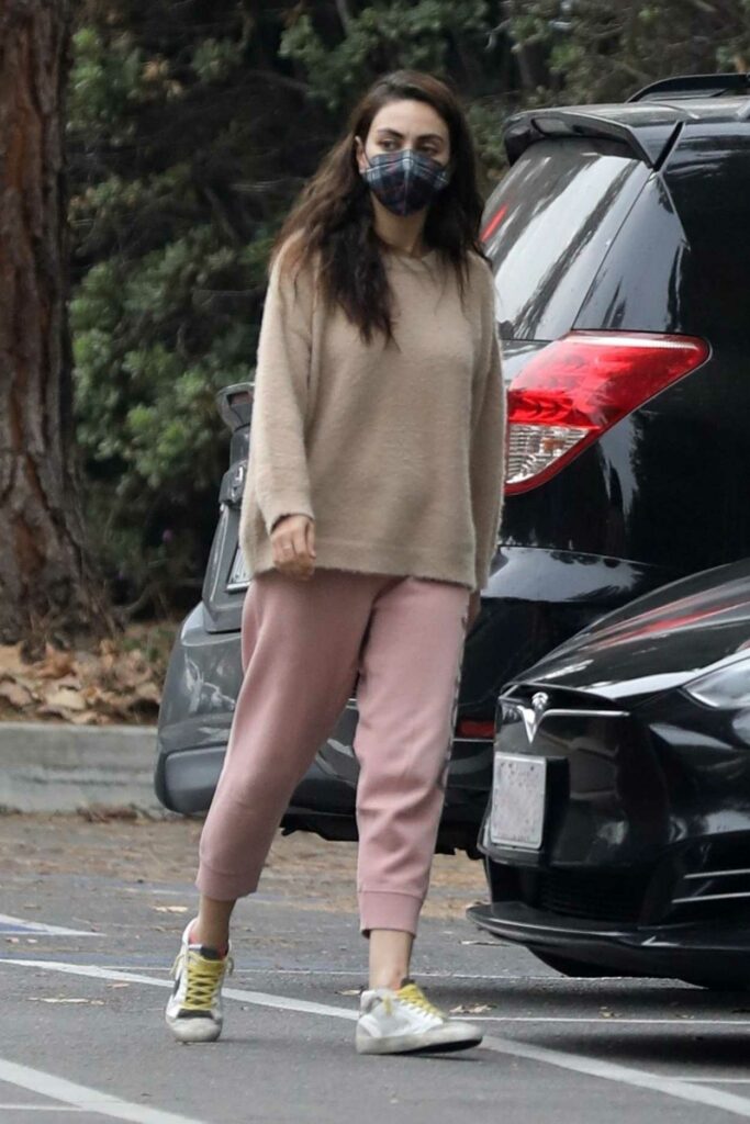 Mila Kunis in a Pink Sweatpants