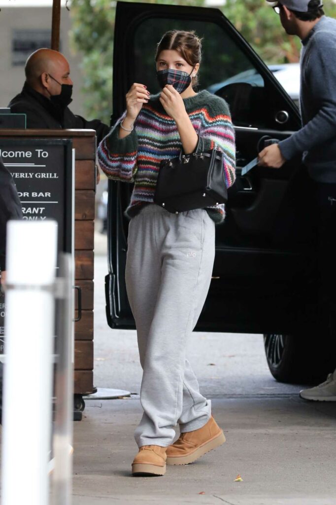 Sofia Richie in a Knitted Striped Sweater