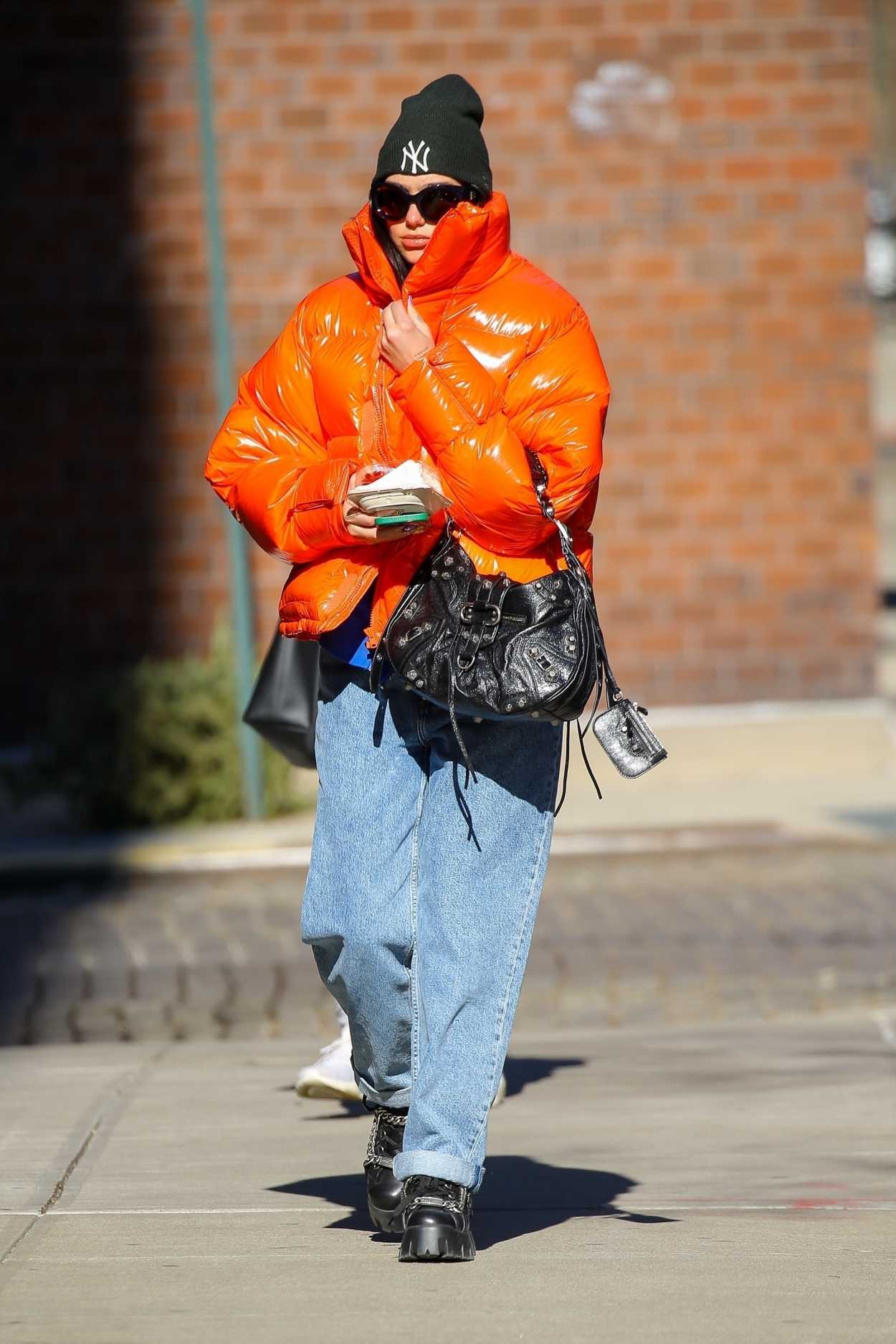 Dua Lipa in an Orange Puffer Jacket Was Seen Out in New York 01/28/2022 ...