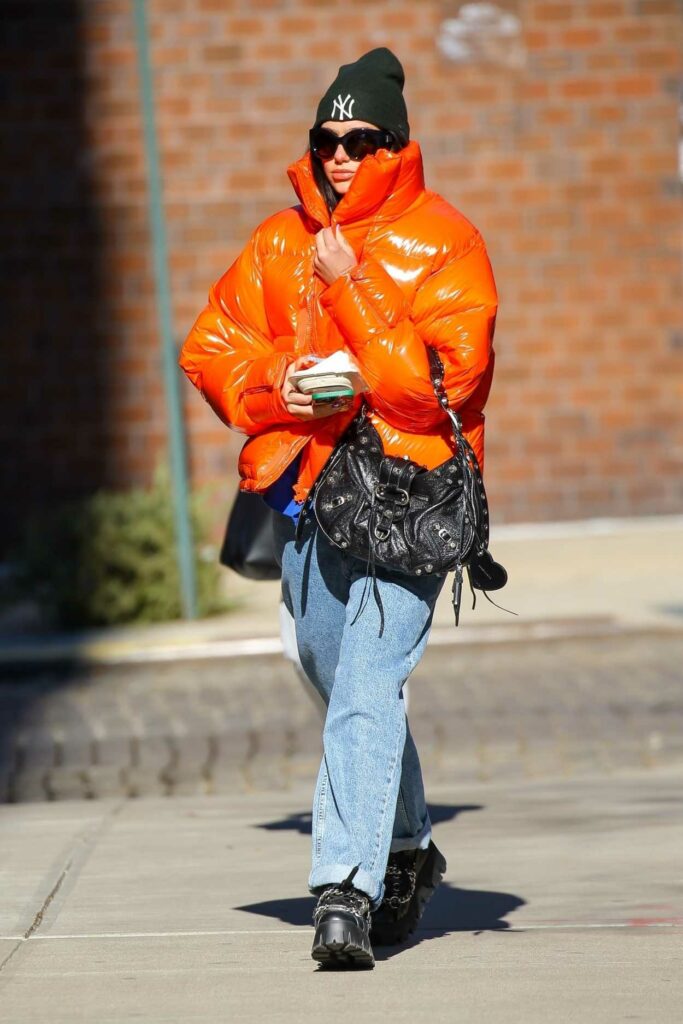 Dua Lipa in an Orange Puffer Jacket