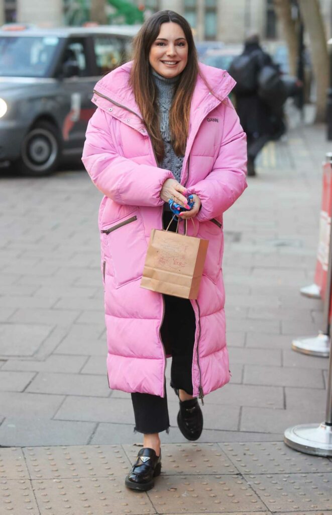 Kelly Brook in a Pink Puffer Coat