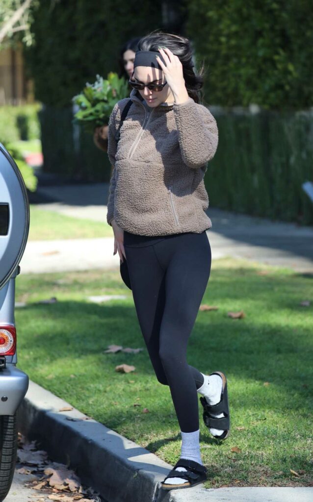 Kendall Jenner in a Black Flip-Flops