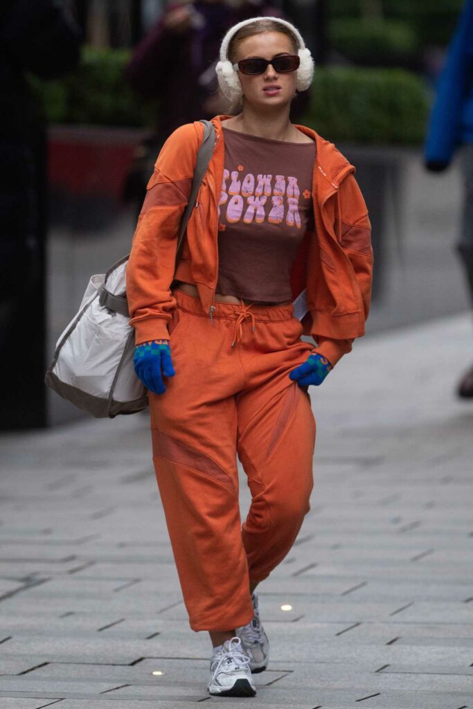 Maisie Smith in an Orange Sweatsuit