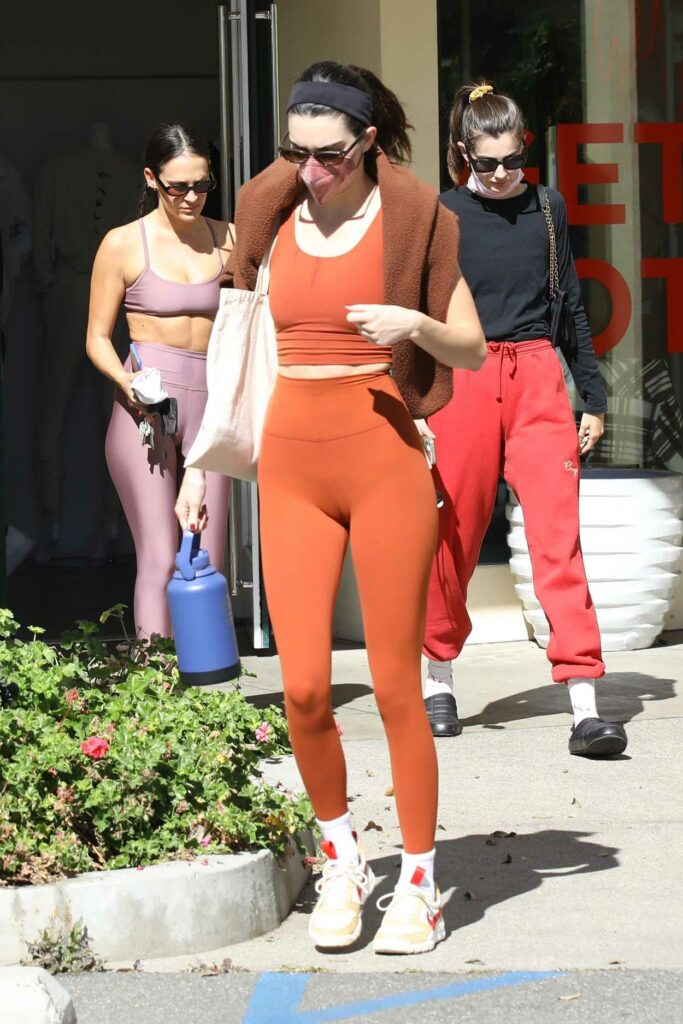 Kendall Jenner in an Orange Workout Ensemble