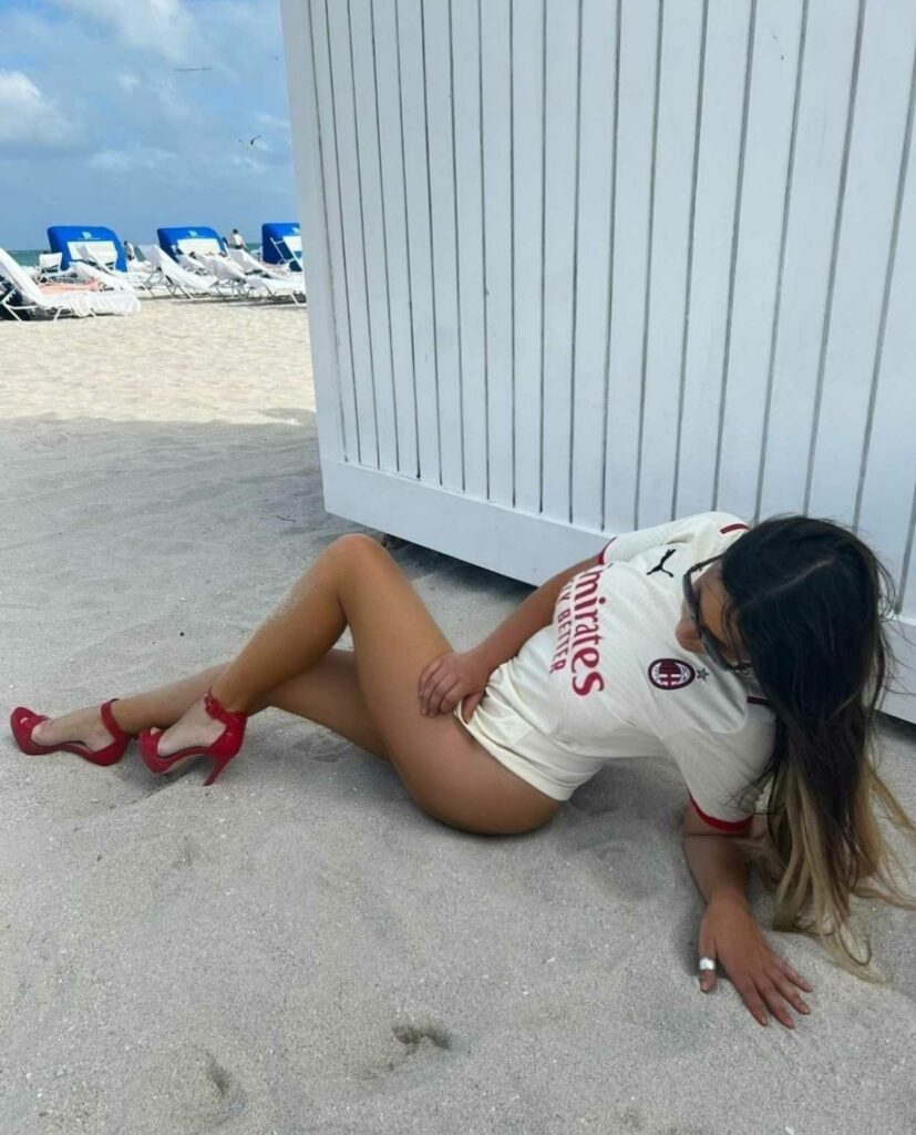 Claudia Romani in a Red Striped Bikini