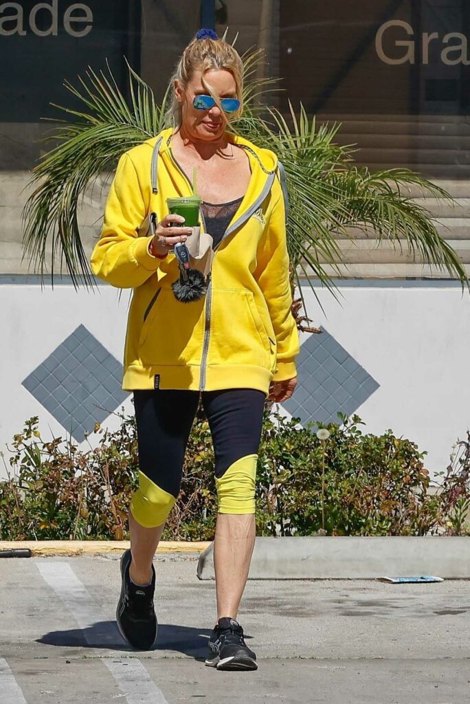 Nicollette Sheridan in a Yellow Hoodie