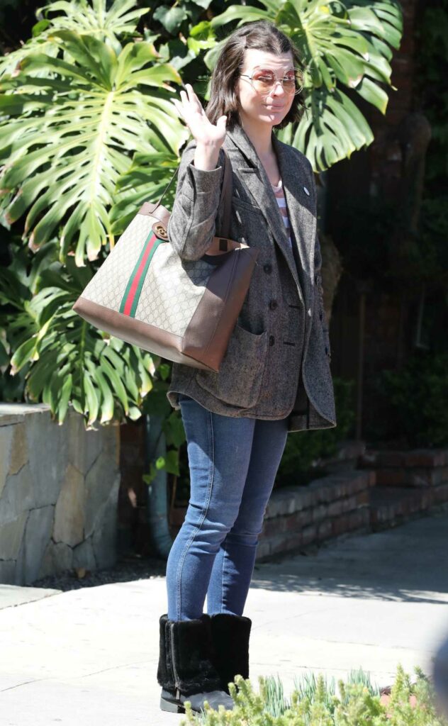 Milla Jovovich in a Grey Blazer
