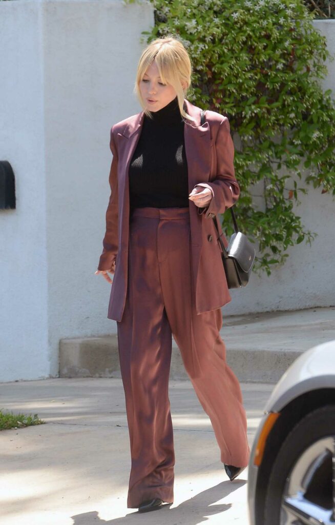 Sydney Sweeney in a Burgundy Business Suit