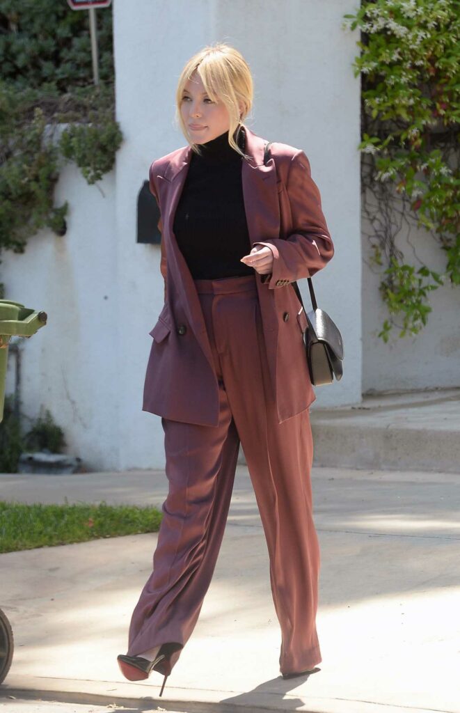Sydney Sweeney in a Burgundy Business Suit