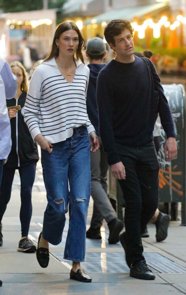 Karlie Kloss in a White Striped Blouse
