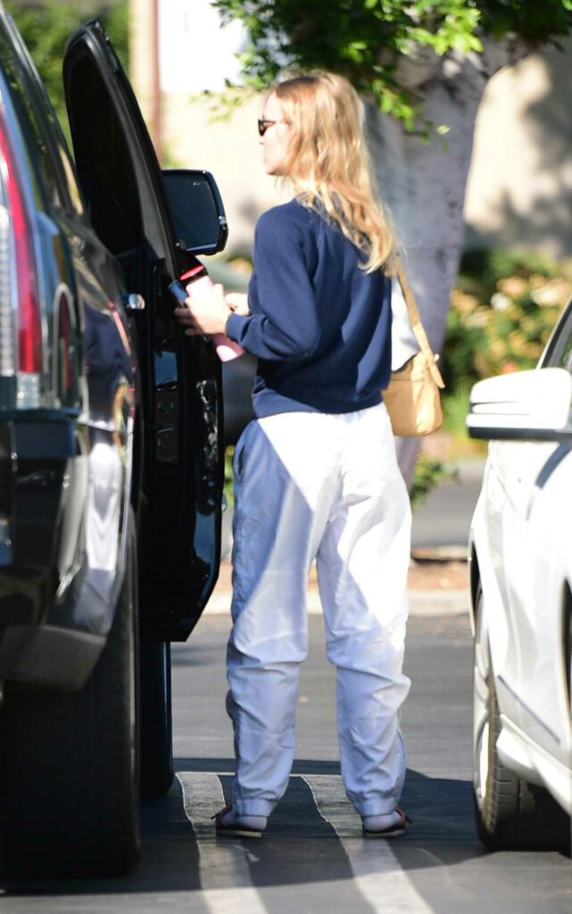 Lily-Rose Depp in a White Sweatpants