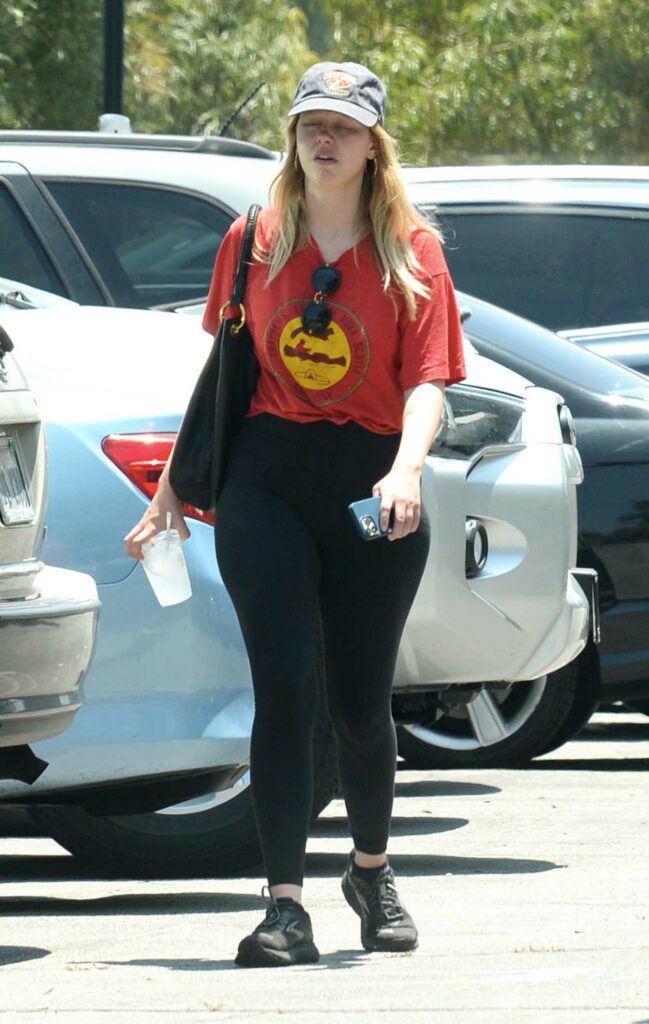 Mia Goth in a Red Tee