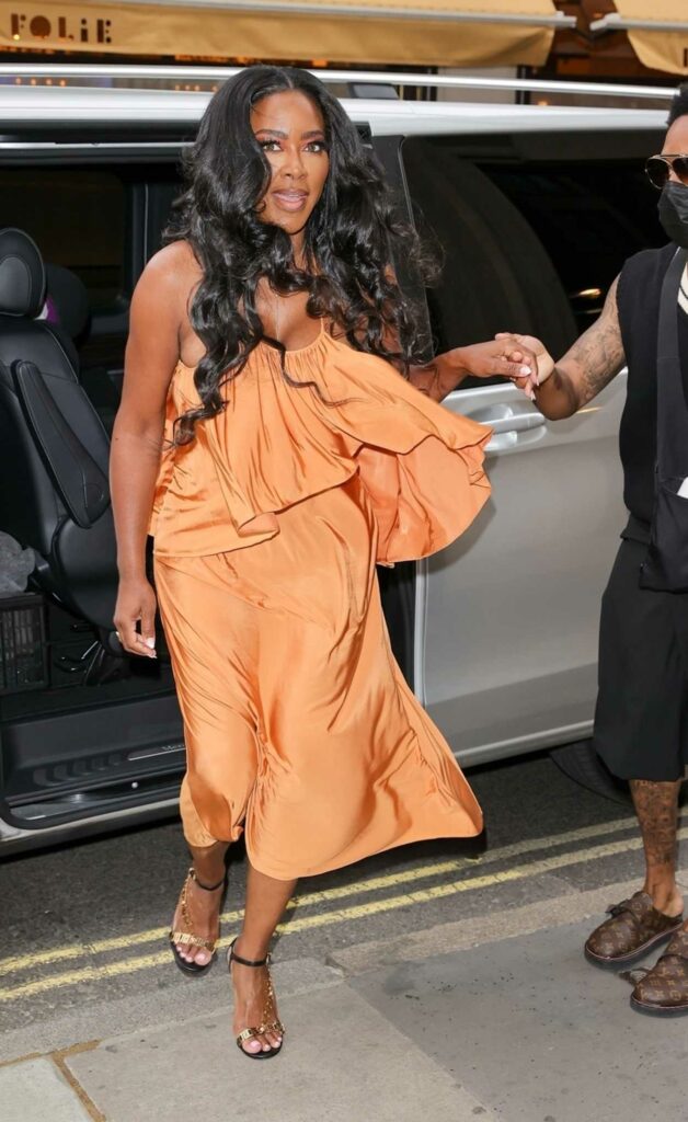 Kenya Moore in an Orange Dress