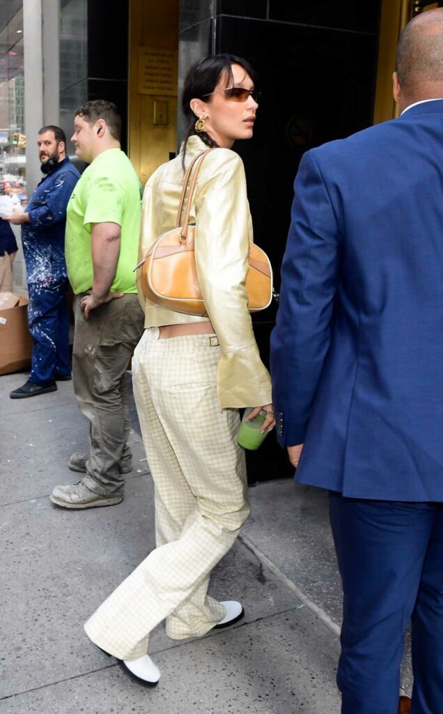 Bella Hadid in a Gold Jacket