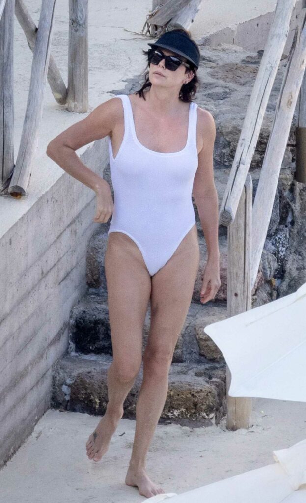 Charlize Theron in a White Swimsuit