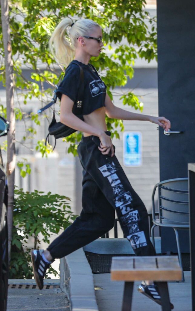 Stella Maxwell in a Black Cropped Tee