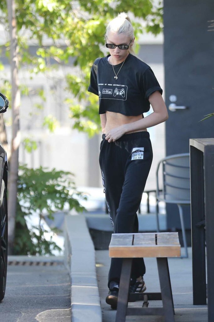Stella Maxwell in a Black Cropped Tee