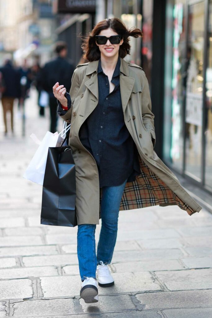 Alexandra Daddario in a Beige Trench Coat Enjoying a Solo Shopping ...