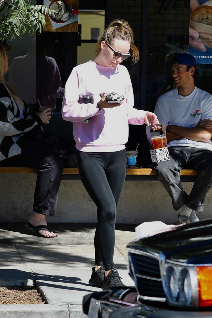 Olivia Wilde in a Purple Sweatshirt