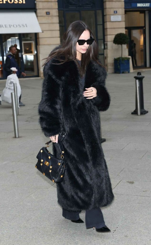 Sofia Carson in a Black Fur Coat