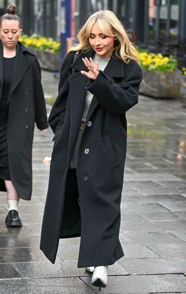 Sabrina Carpenter in a Black Coat
