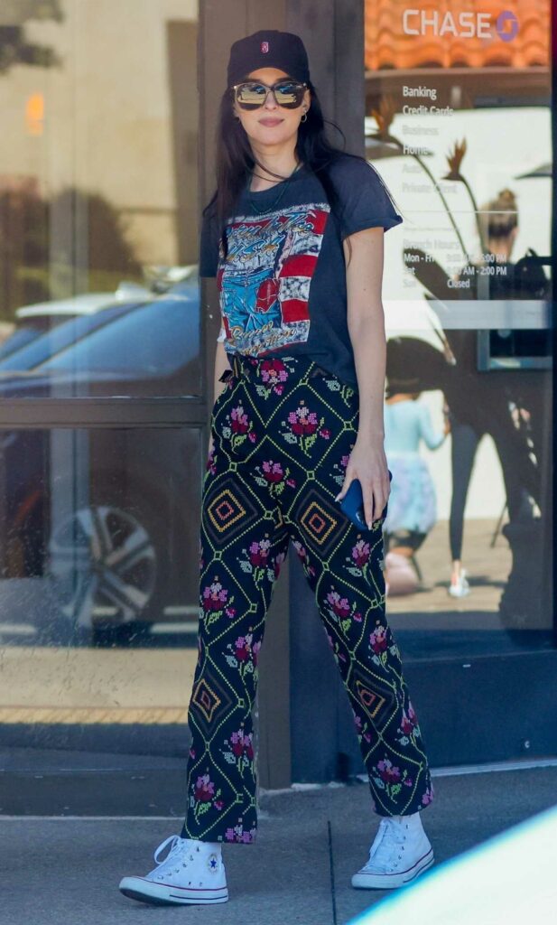 Dakota Johnson in a Black Patterned Pants