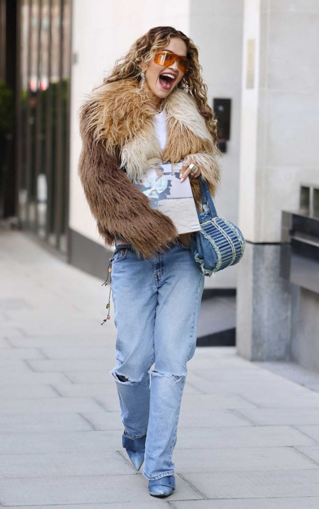Rita Ora in a Blue Ripped Jeans