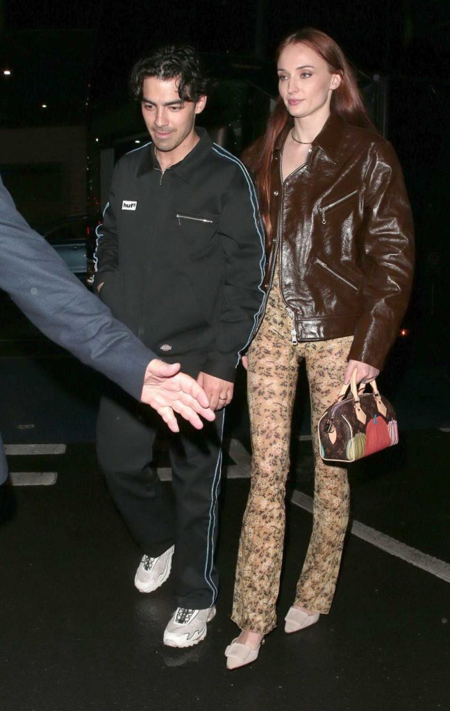 Sophie Turner in a Brown Leather Jacket