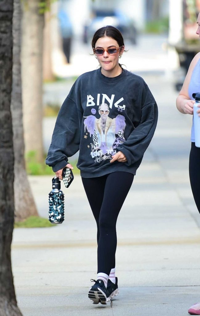 Lucy Hale in a Black Sneakers