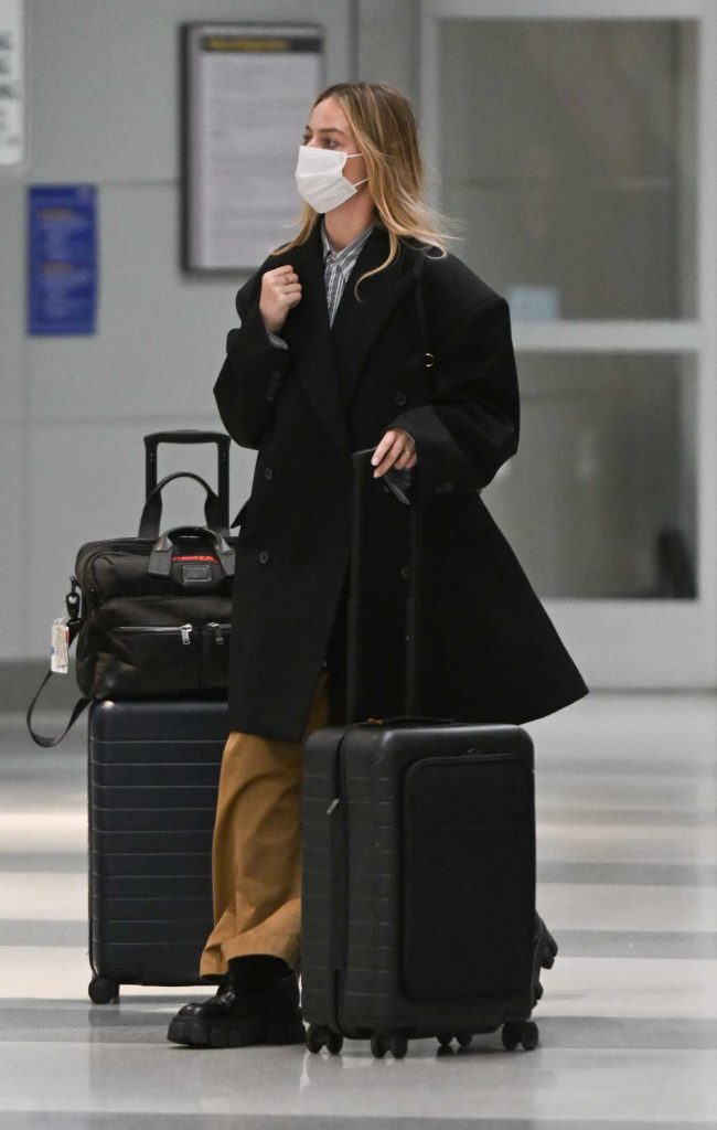 Margot Robbie in a Black Coat