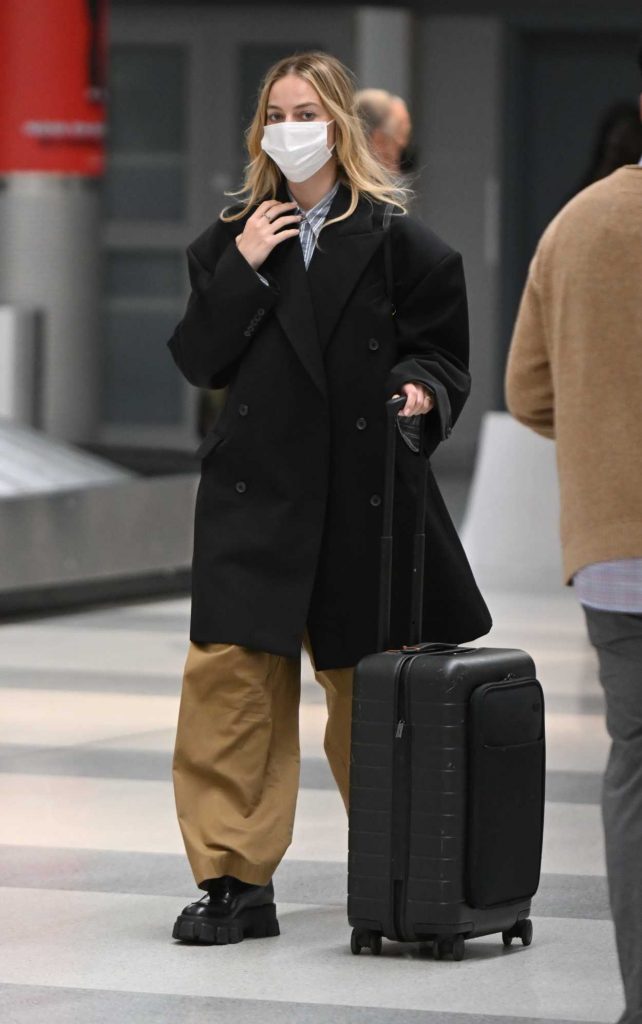 Margot Robbie in a Black Coat