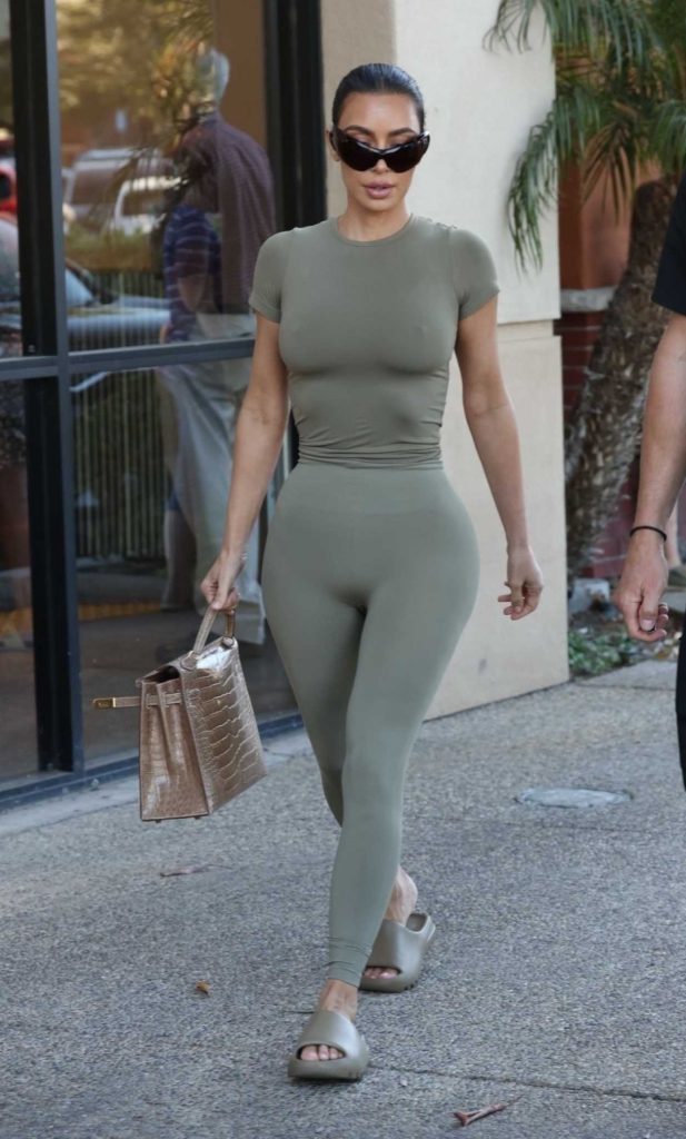 Kim Kardashian in an Olive Workout Ensemble
