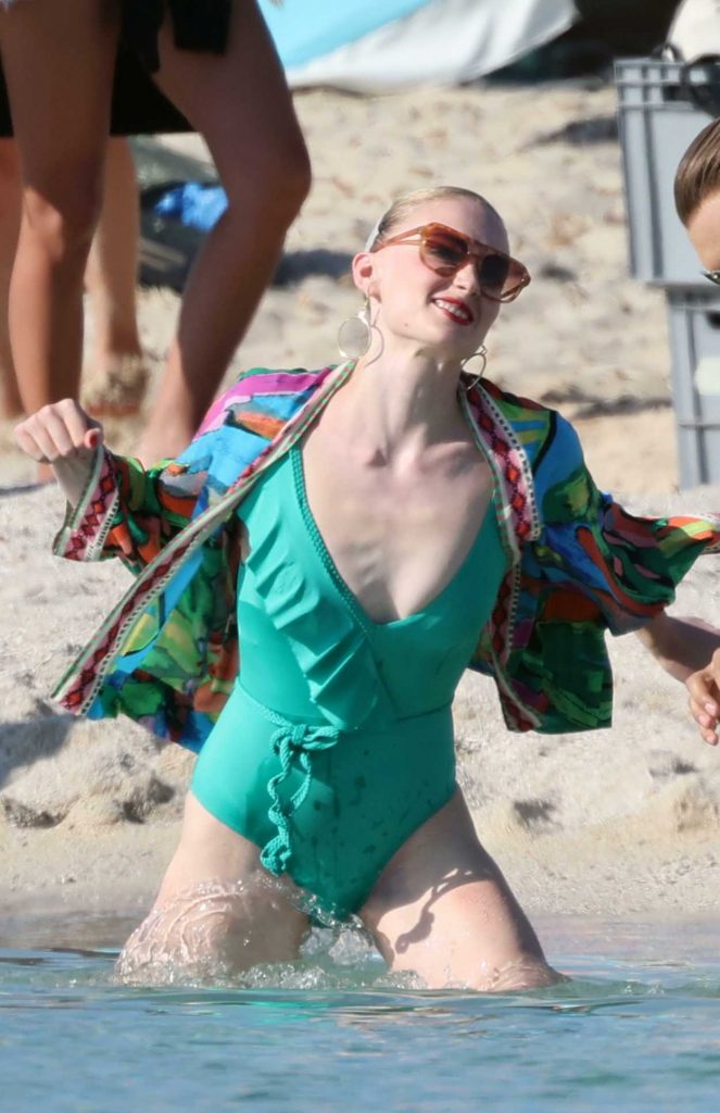 Sophie Turner in a Green Swimsuit