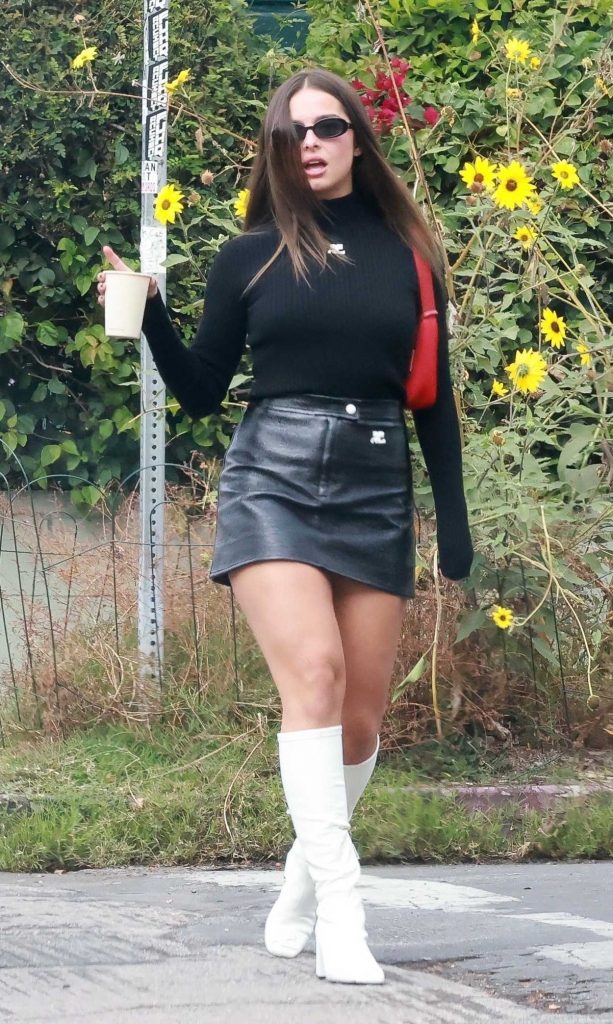 Addison Rae in a Black Leather Mini Skirt