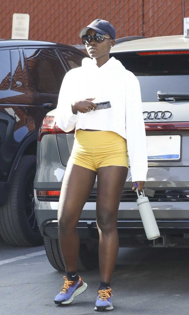 Lupita Nyong'o in a Yellow Spandex Shorts