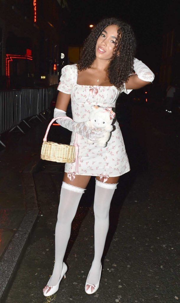 Anya Lawrence in a White Floral Mini Dress
