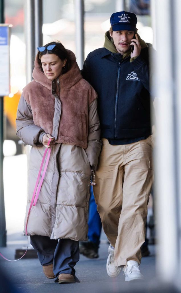 Millie Bobby Brown in a Beige Puffer Coat