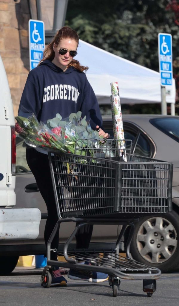 Anna Osceola in a Navy Hoodie