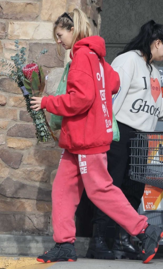 Jessica Hart in a Red Sweatsuit