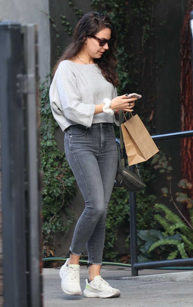 Mila Kunis in a White Sneakers