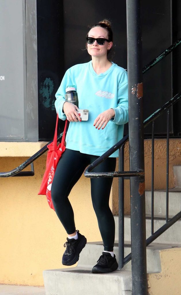 Olivia Wilde in a Turquoise Sweatshirt