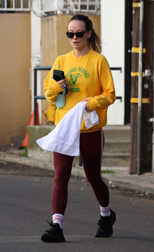 Olivia Wilde in a Yellow Sweatshirt