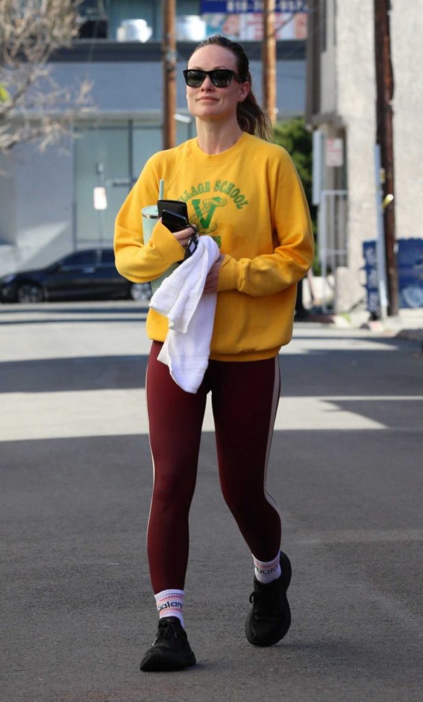 Olivia Wilde in a Yellow Sweatshirt