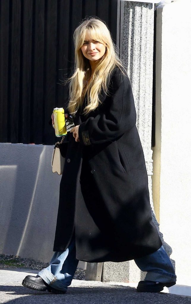 Sabrina Carpenter in a Black Coat