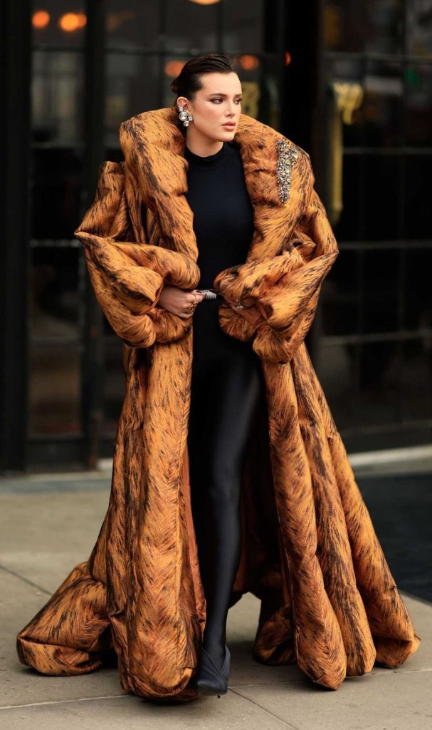 Bella Thorne in an Orange Coat