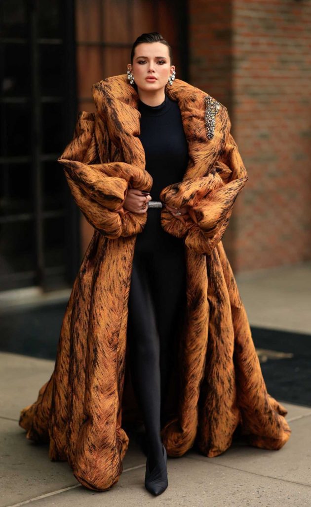 Bella Thorne in an Orange Coat