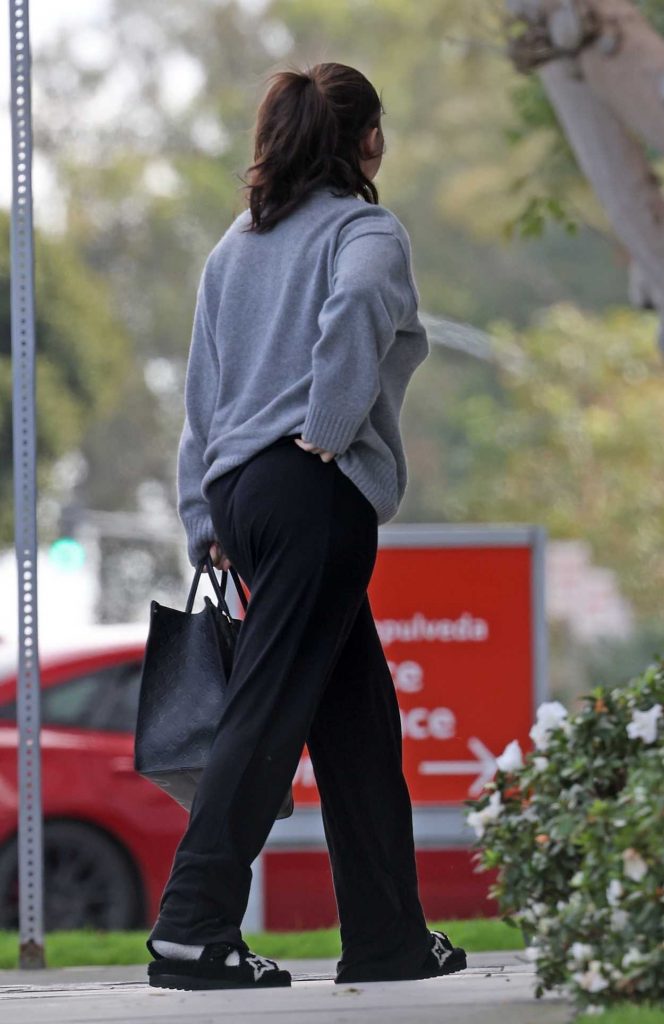 Selena Gomez in a Grey Sweater