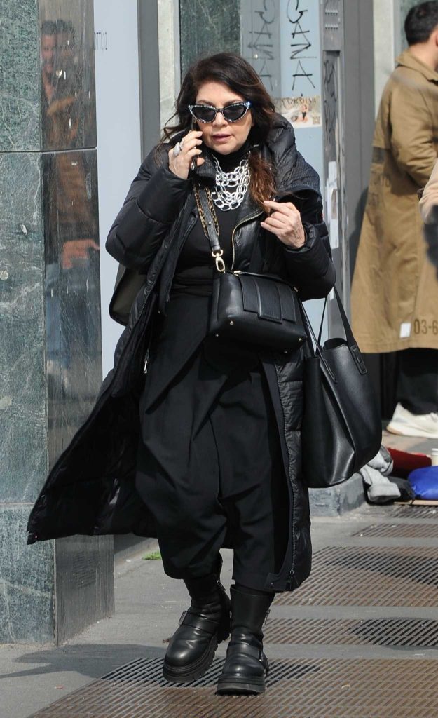 Cristina D'Avena in a Black Puffer Coat