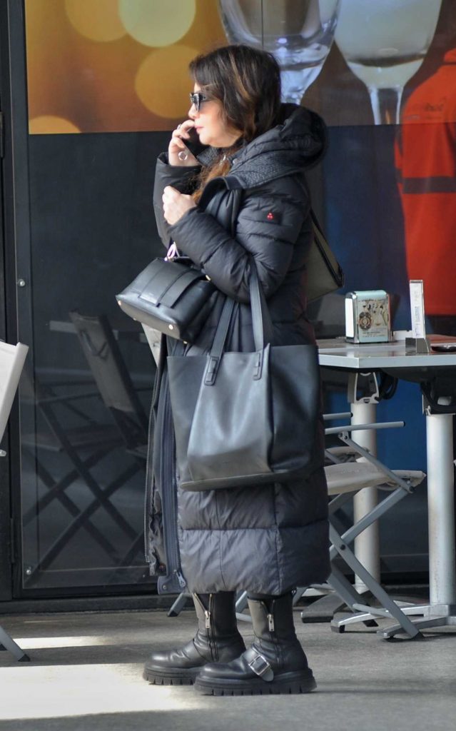 Cristina D'Avena in a Black Puffer Coat