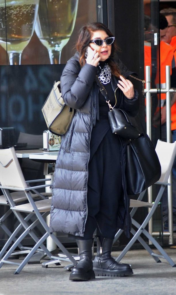 Cristina D'Avena in a Black Puffer Coat